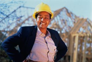 Woman wearing hard hat, portrait