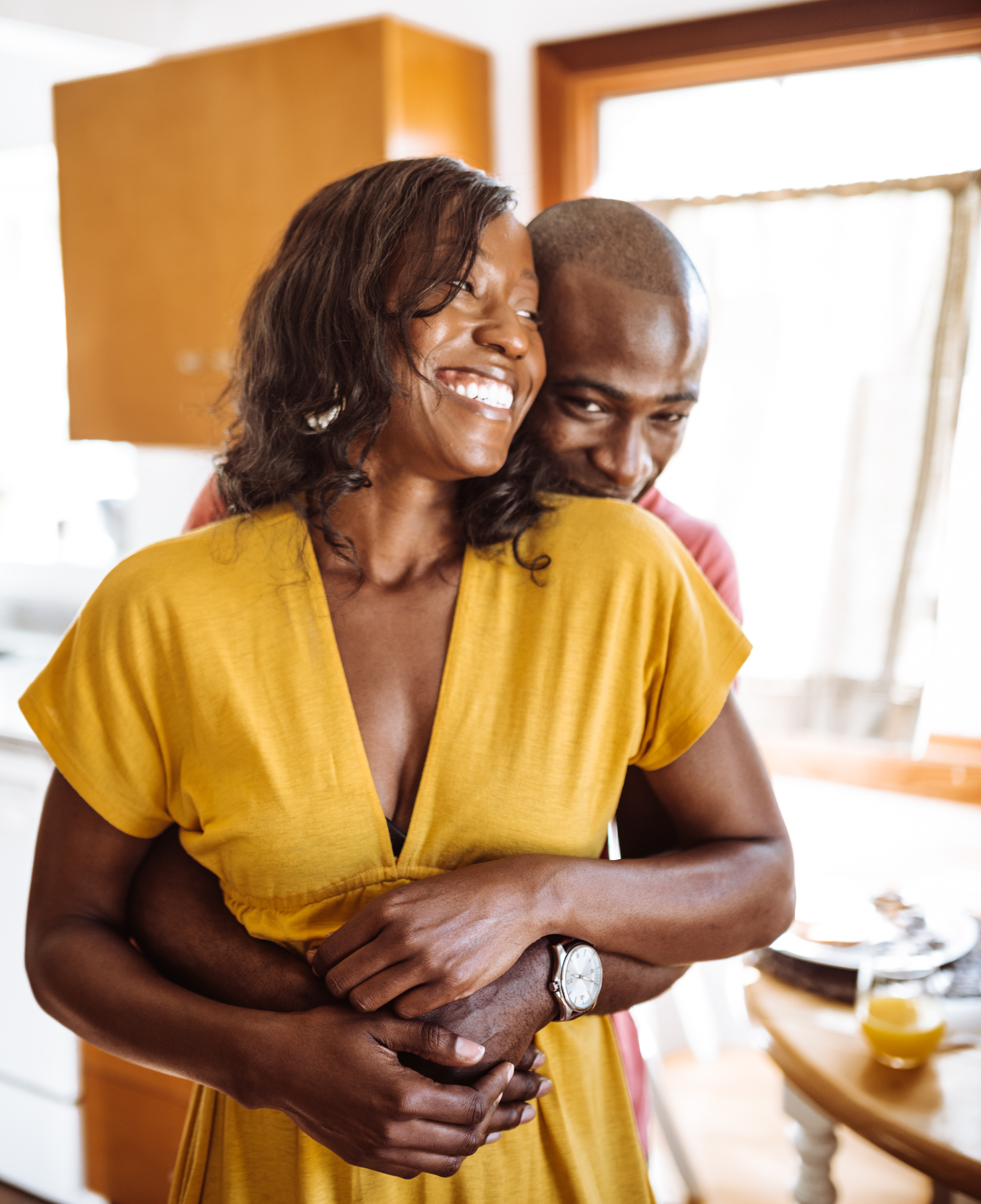couple embracing in the kitchen