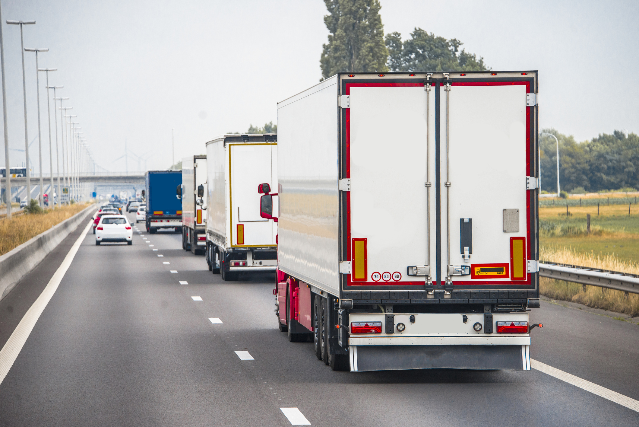 Trucks in a row on a highway