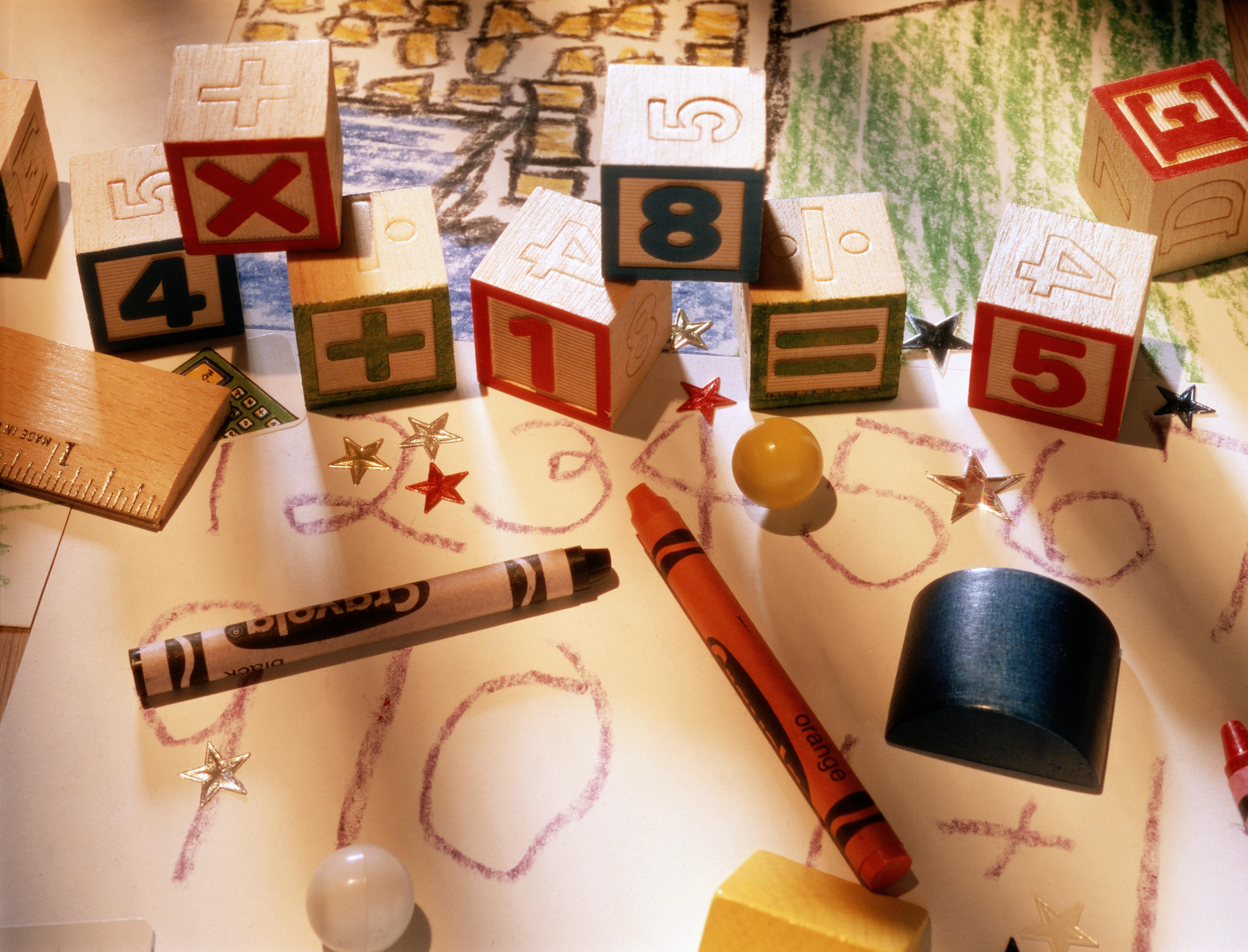 Child's drawings, crayons and blocks, elevated view