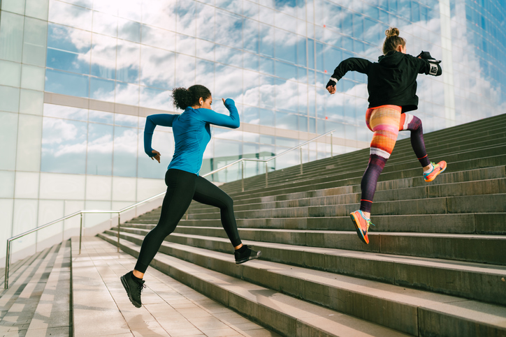 Sportswomen sprinting in the city