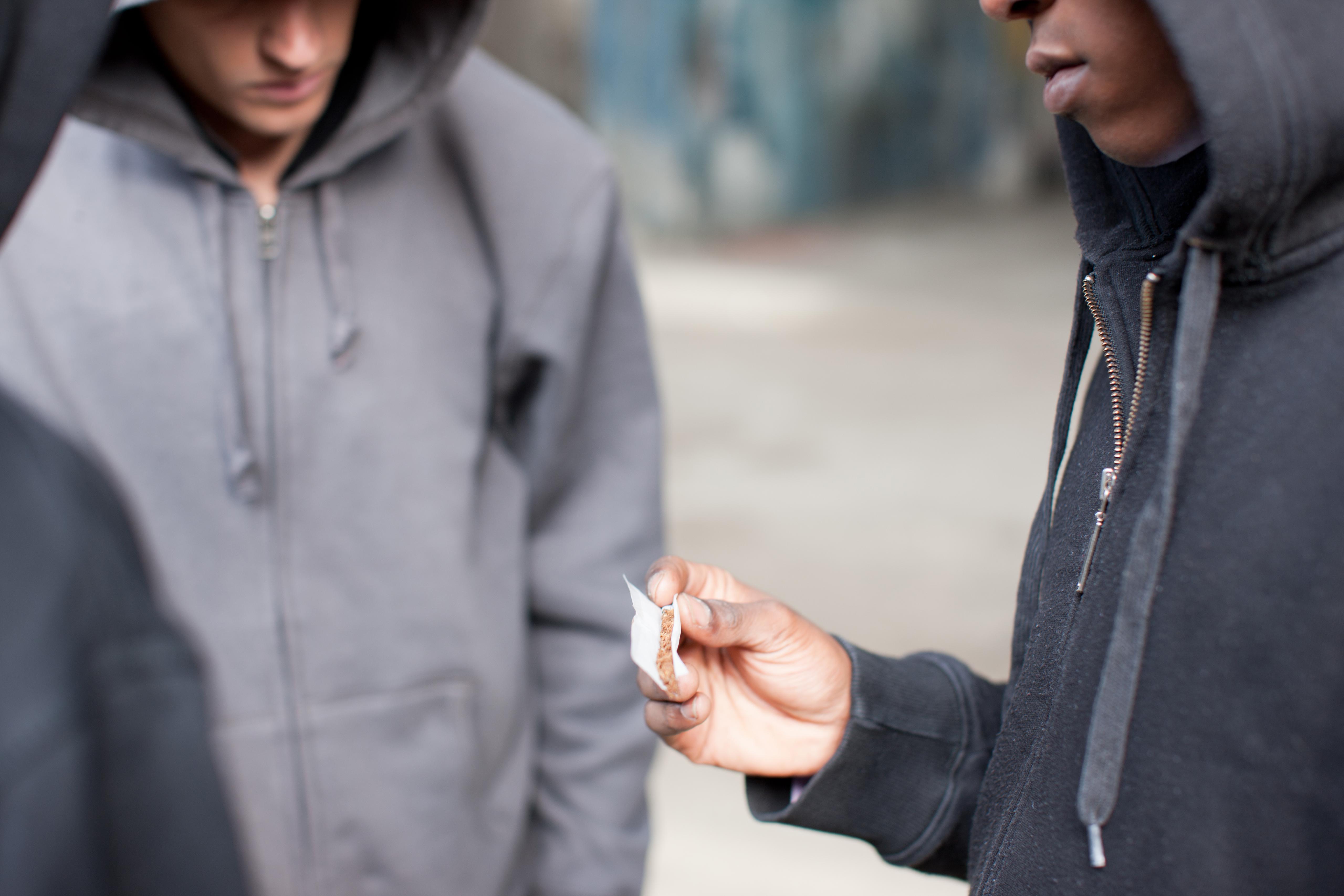 Friends about to smoke marijuana