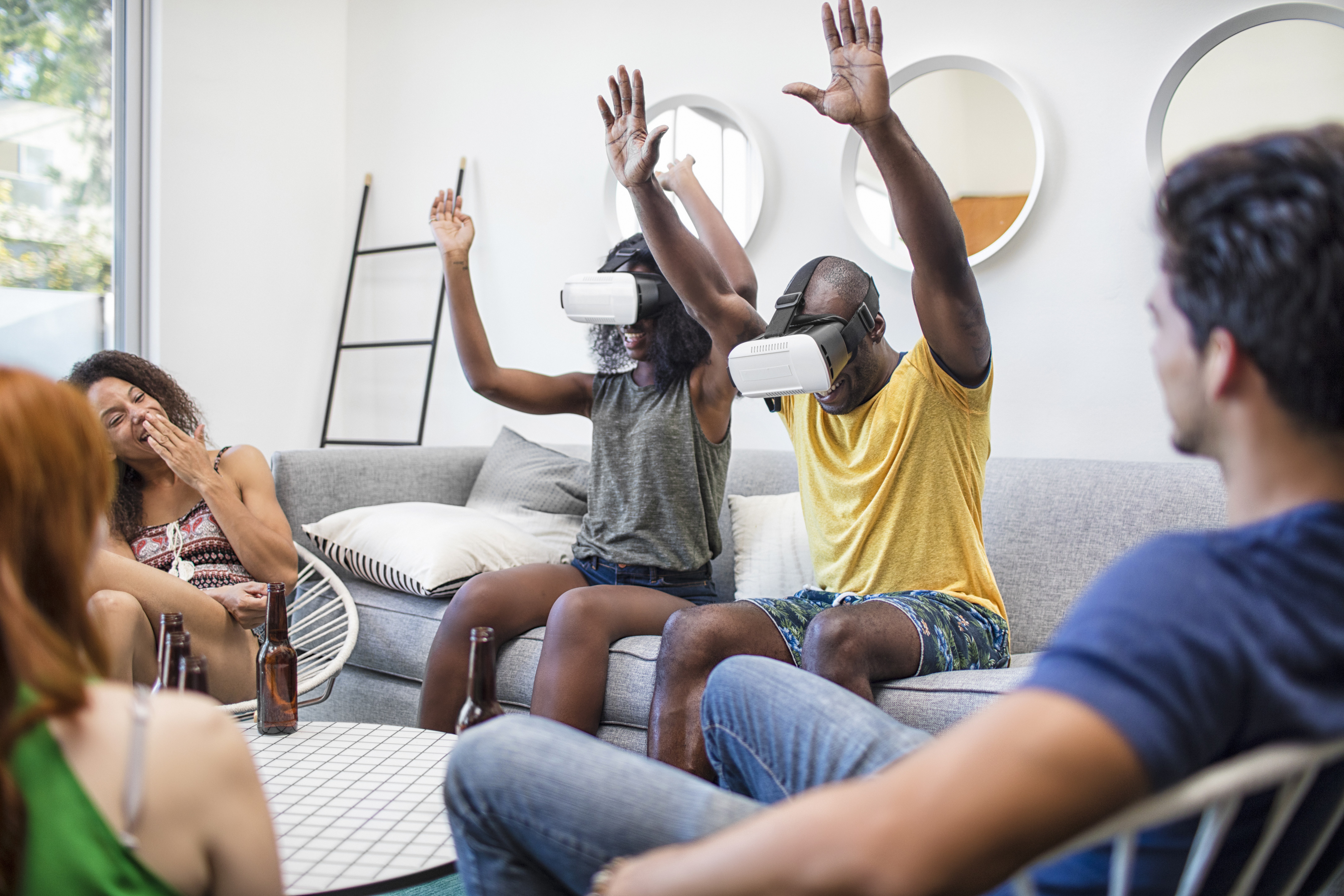 Young friends have fun with their VR goggles